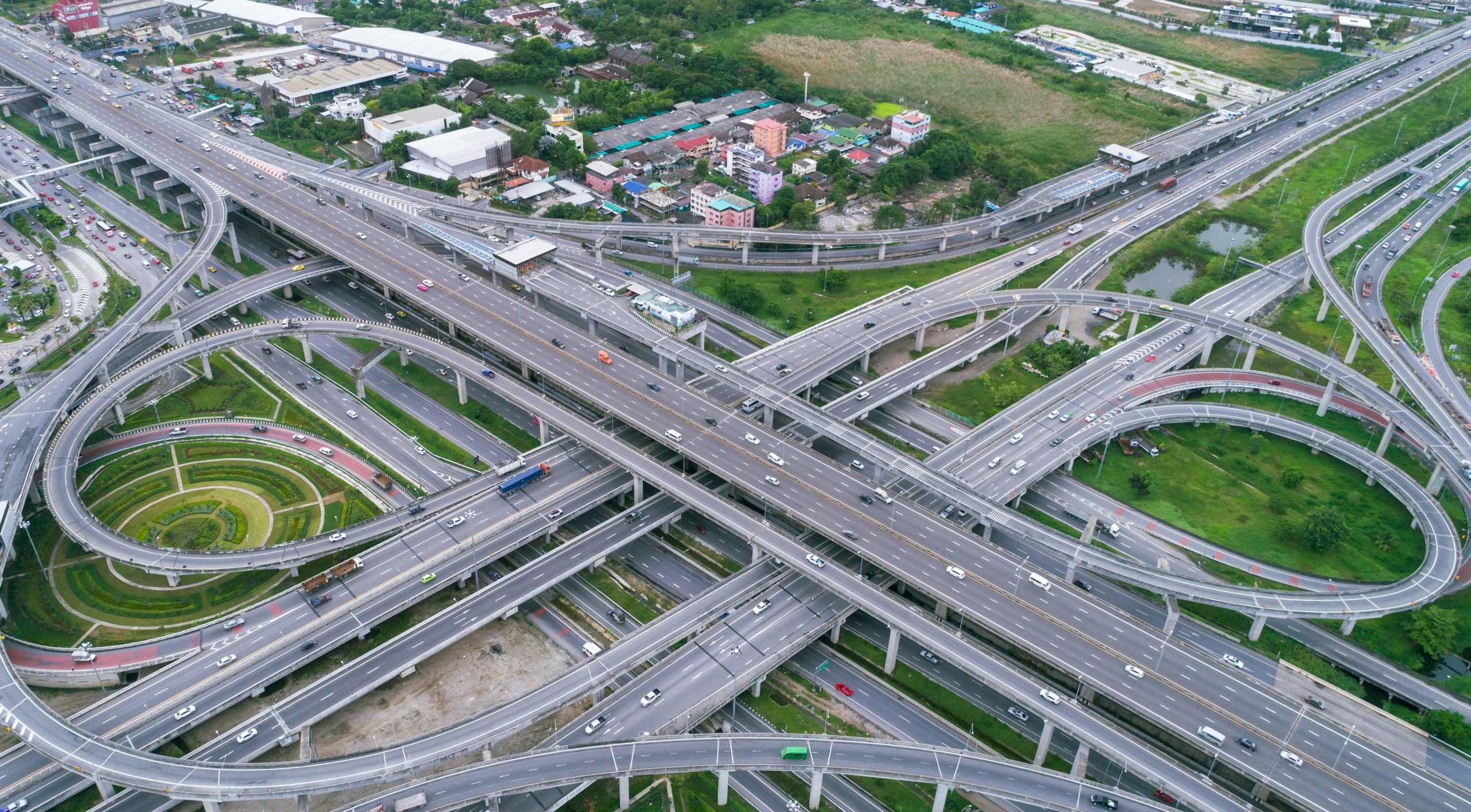 An aerial view of a complicated highway interchange - the visual representation of AI without guardrails or a plan in an association. Too many roads, too many possibilities, and no clear instructions on how to use the technology.