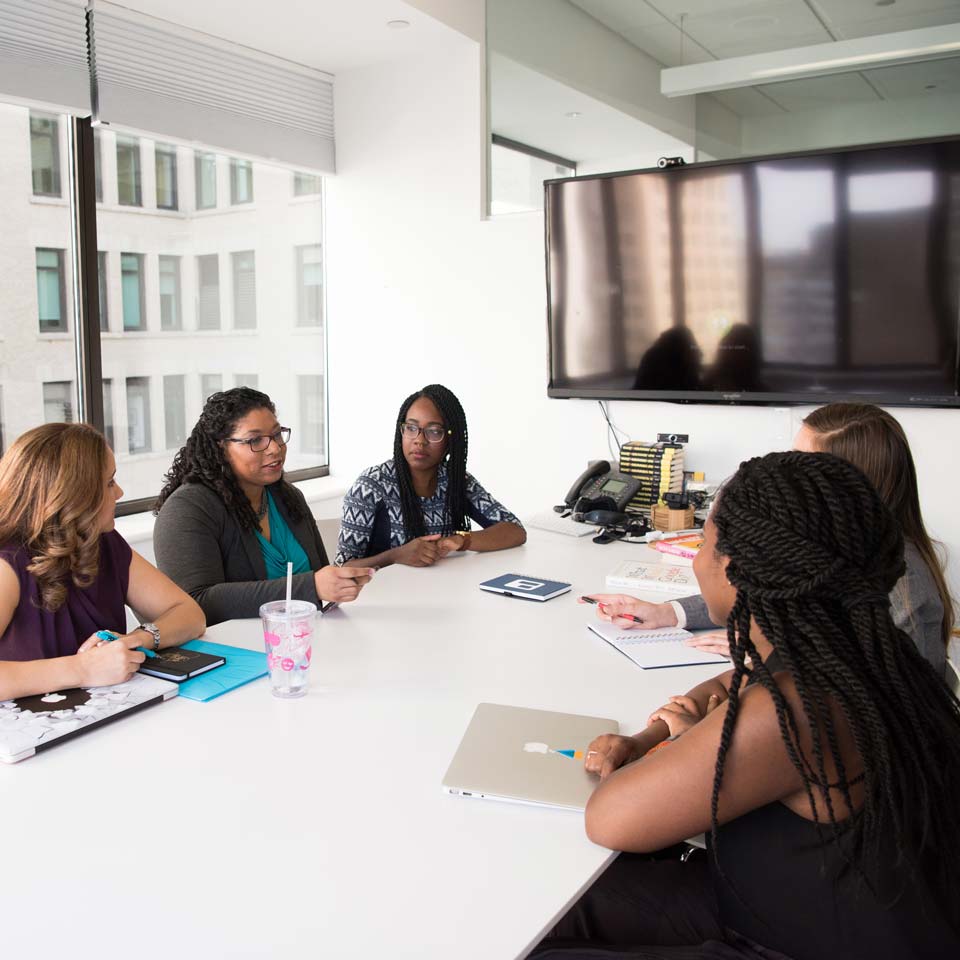 Small group of women meeting in a conference room